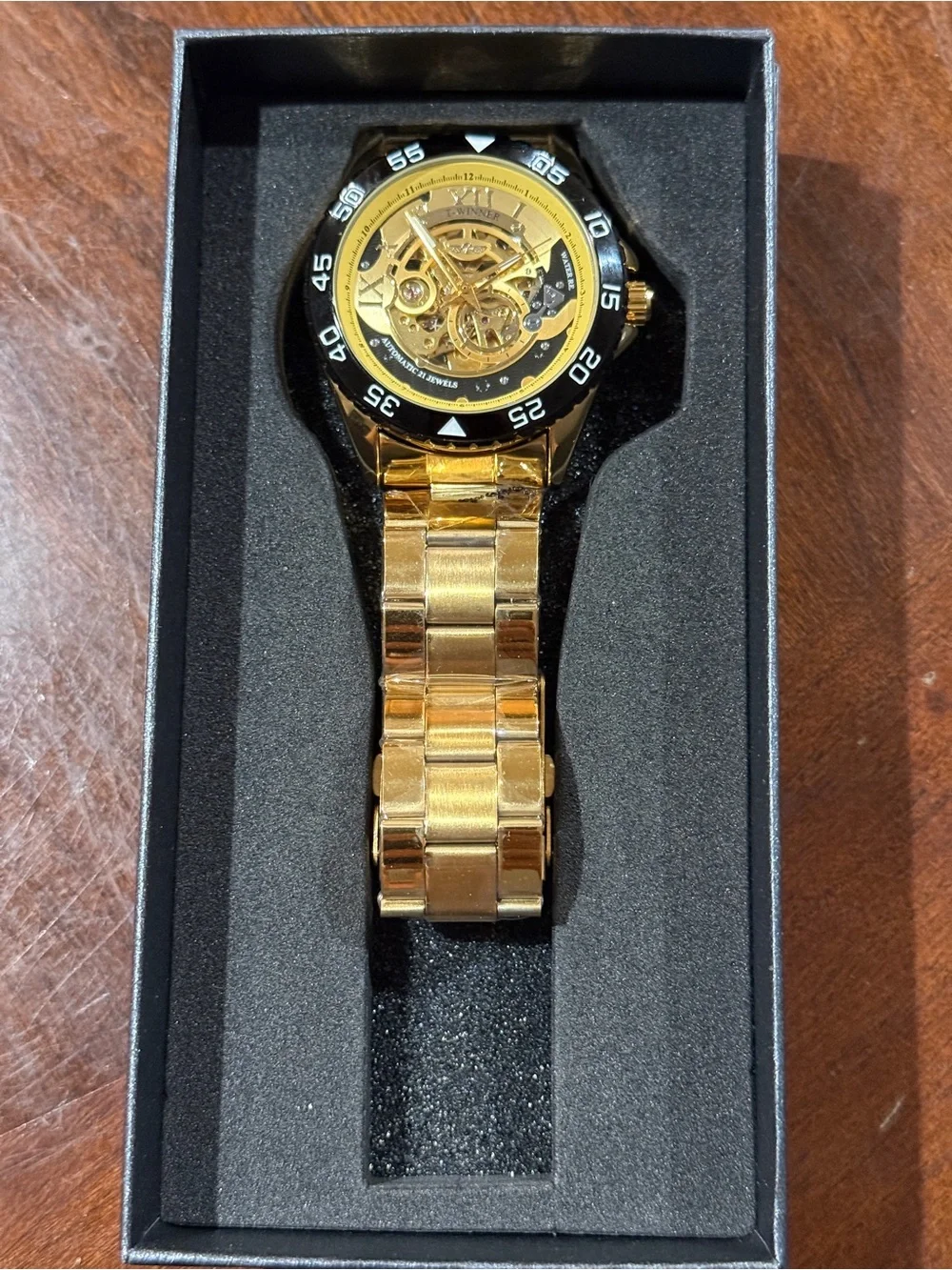 Men's Gold Skeleton Automatic Watch with Black Bezel